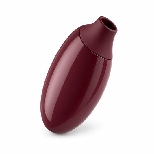 Angled burgundy suction vibrator showing compact oval body and soft top opening