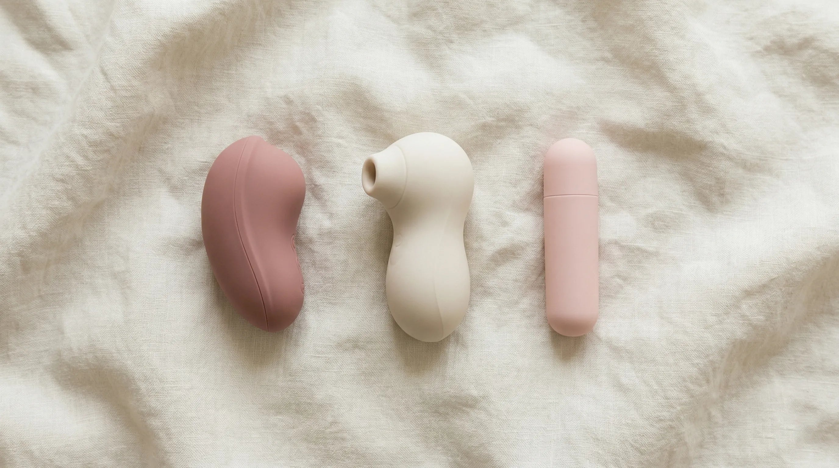 Three first vibrator types compared — compact clitoral, sonic suction, and bullet styles side by side