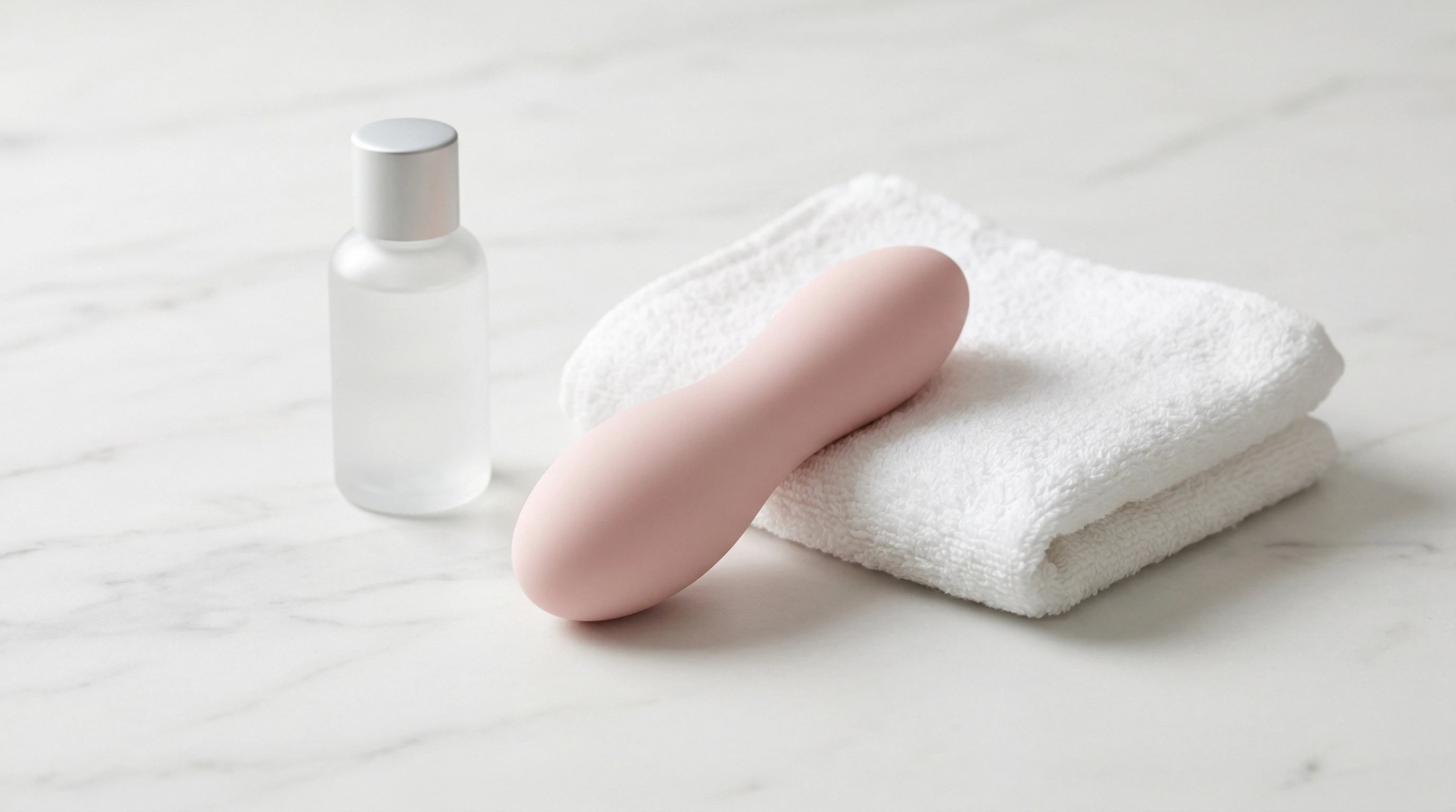Vibrator setup with water-based lubricant and towel — beginner's guide essentials