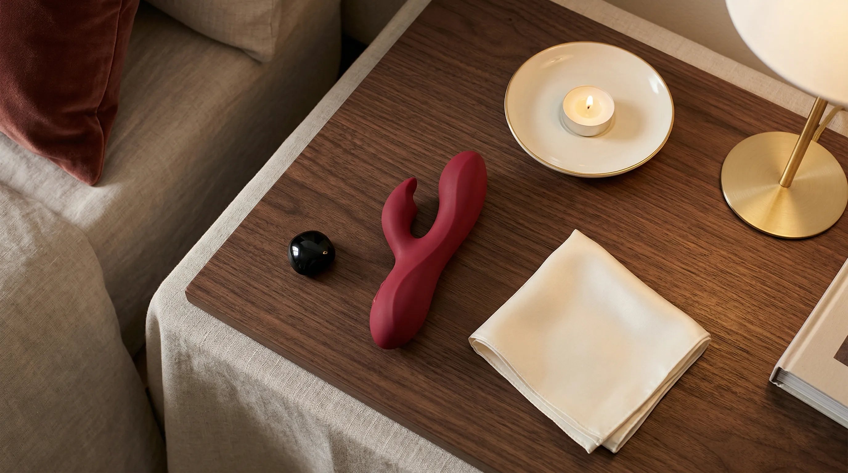 Luxury vibrator resting openly on nightstand as a design object — Xindari sculptural wellness