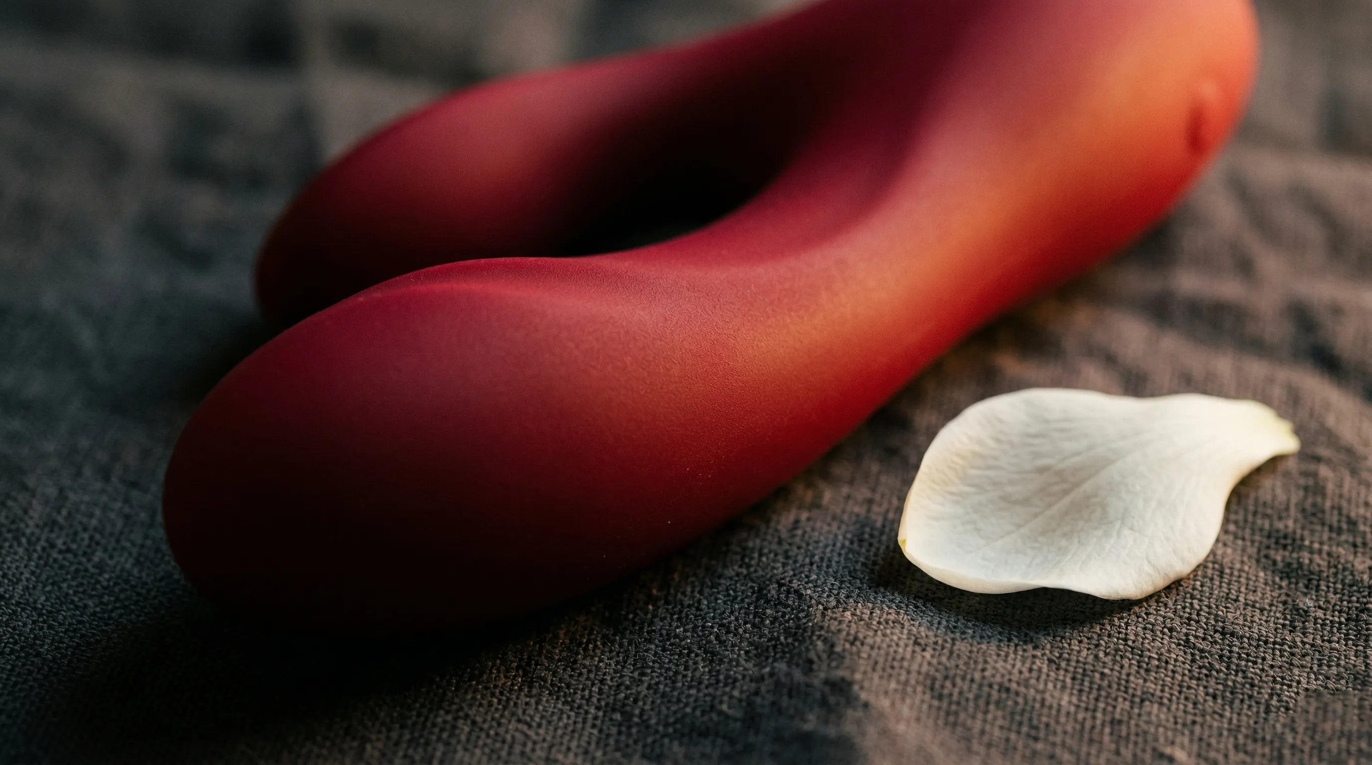 Close-up of luxury vibrator silicone surface — matte, velvety texture of premium medical-grade material