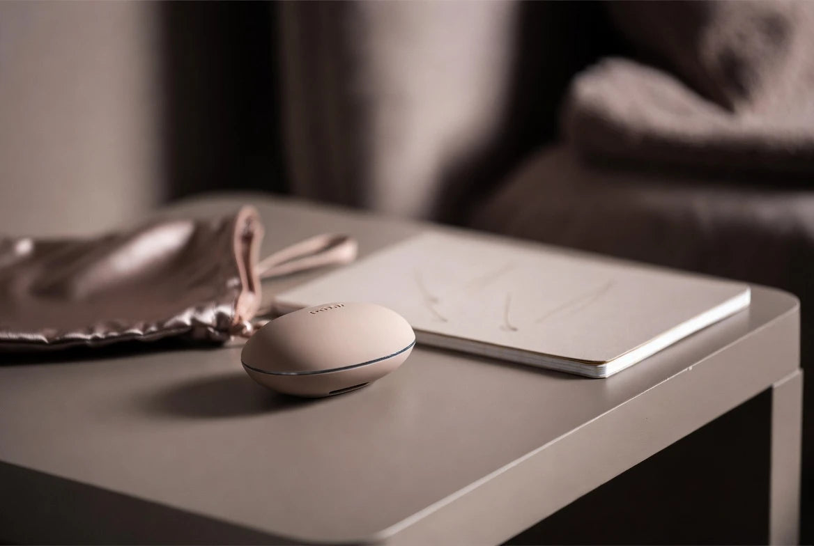 Discreet wellness device and checklist notebook representing a fit-check approach to self-discovery